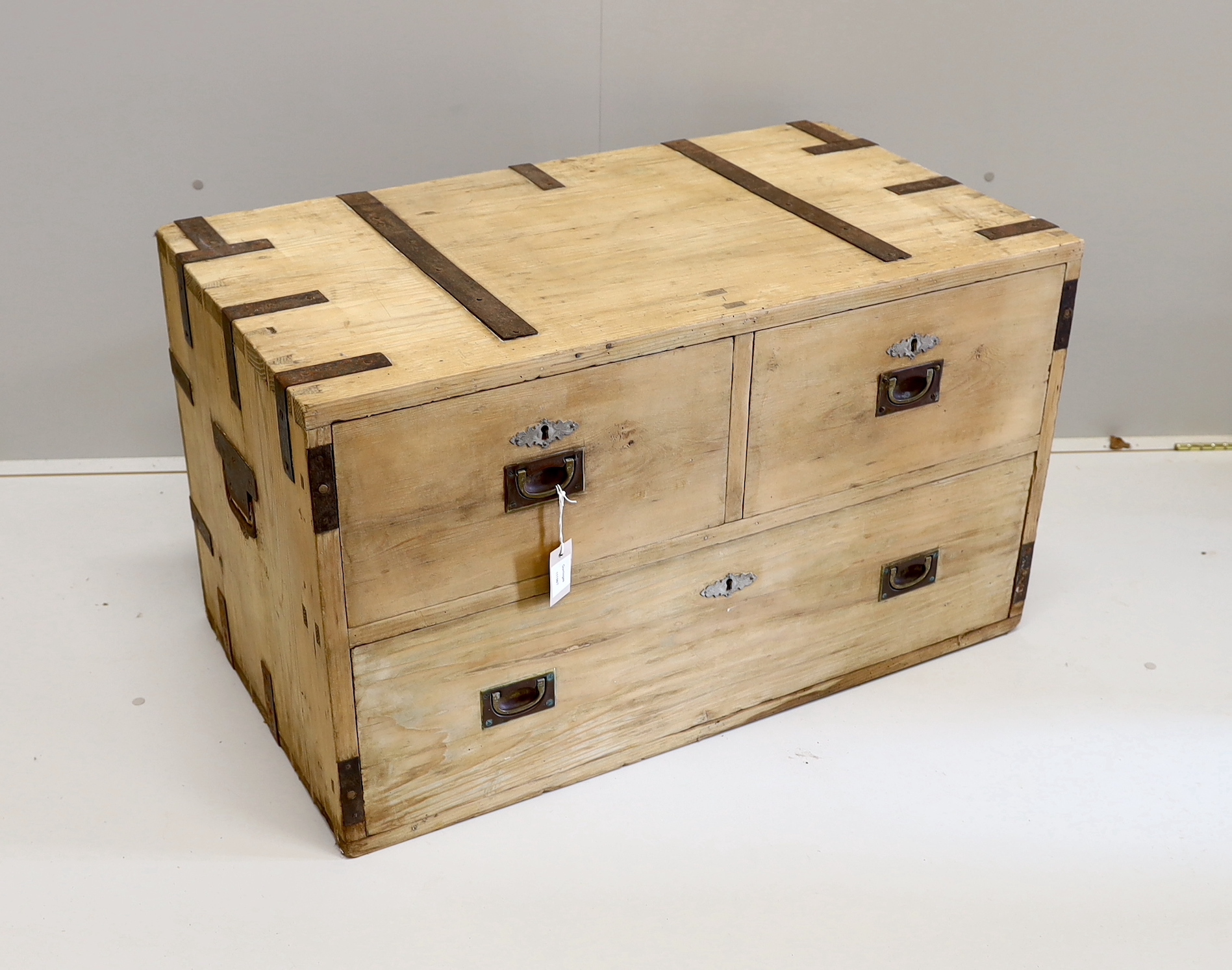 A 19th century iron bound pine three drawer low chest, width 96cm, depth 54cm, height 56cm